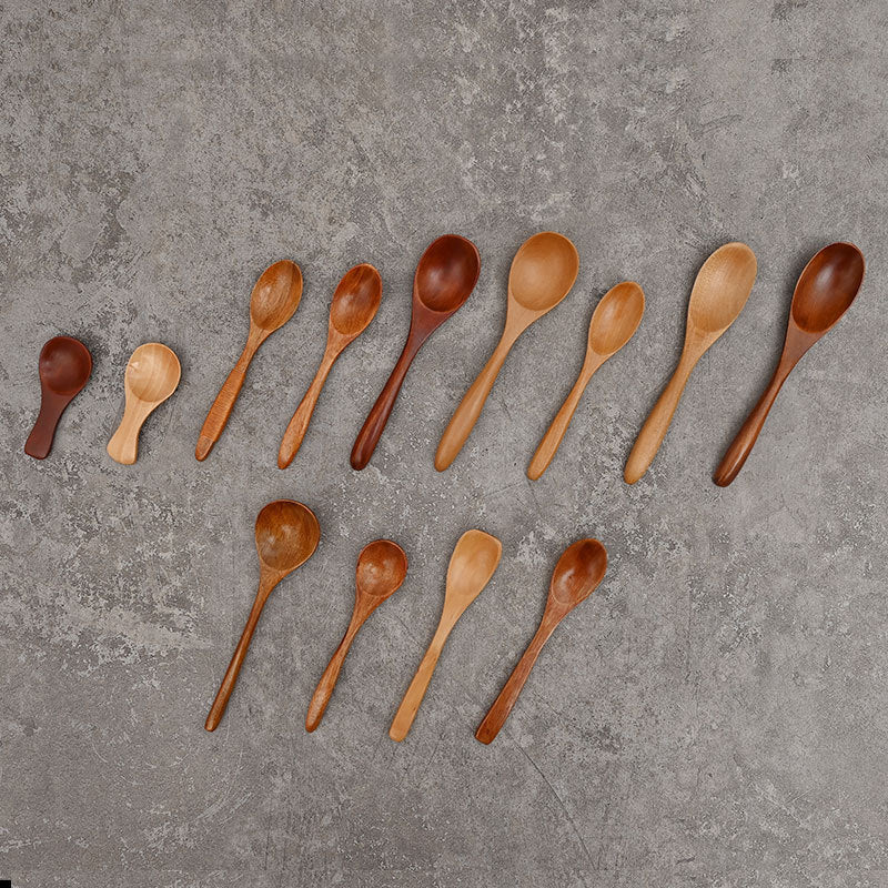 Set of solid wooden kitchen spoons for household cooking and serving – eco-friendly and durable utensils.