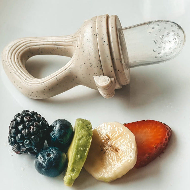 Baby food teether for introducing fruit and vegetable solids; soft silicone feeder soothes teething and encourages self-feeding.