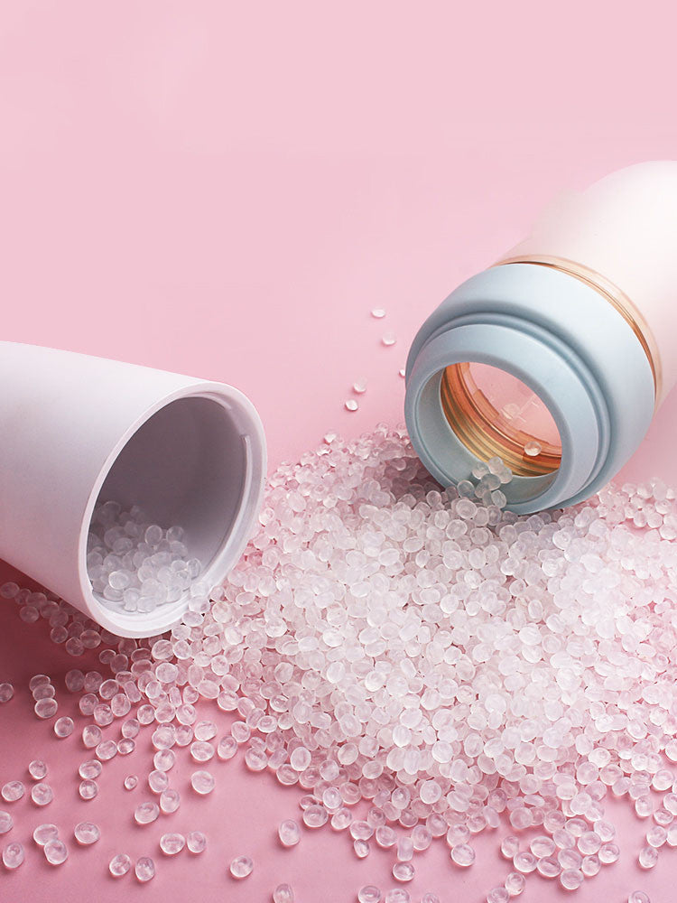 Soft silicone baby rice cereal spoon feeder with squeeze function for mess-free feeding.