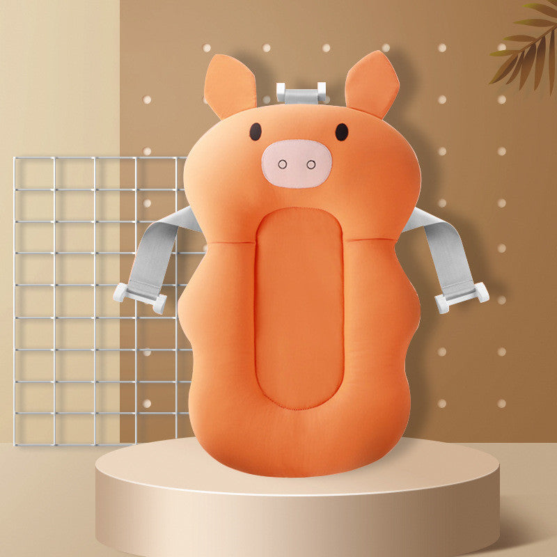 Orange pig baby bath sponge with colorful bath beads and feather toy, ensuring safe and enjoyable bath time.