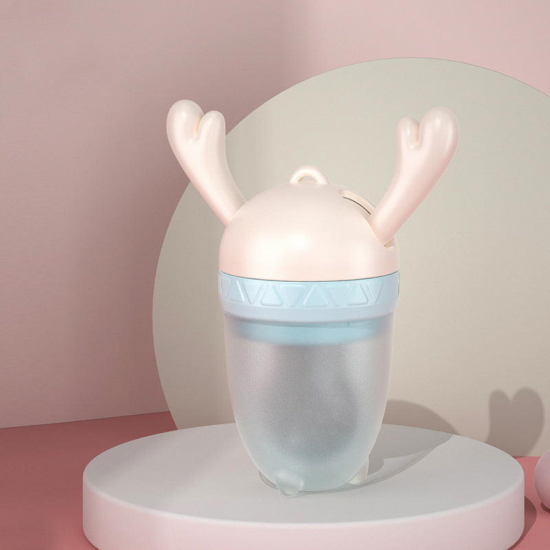 Soft silicone baby teether nipple with molar stick design and food feeder for safe teething and feeding.
