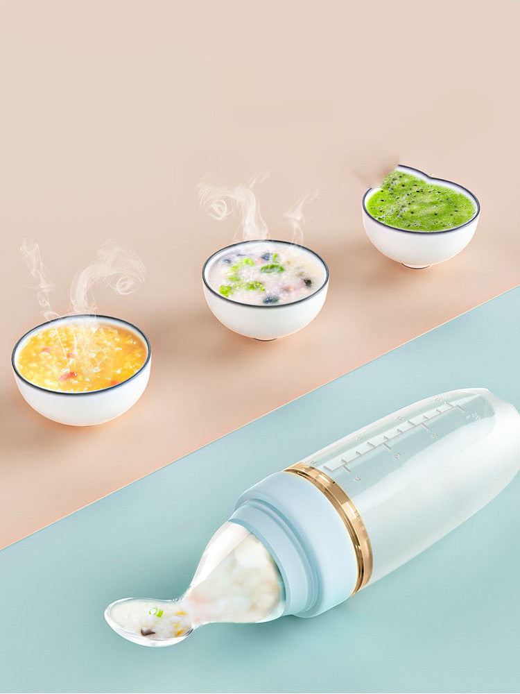 Soft silicone baby rice cereal spoon feeder with squeeze function for mess-free feeding.
