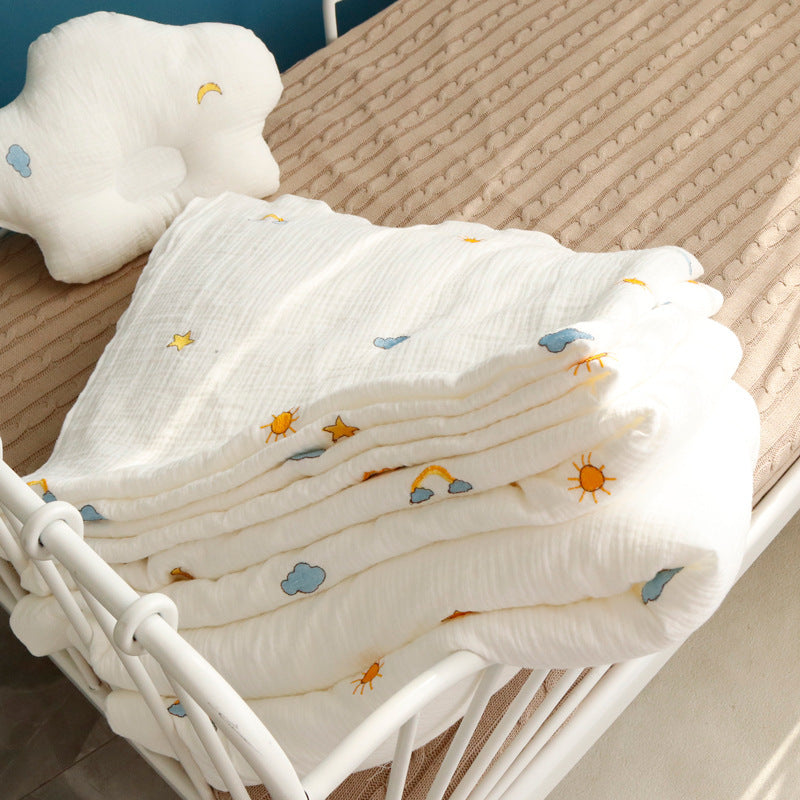 Soft quilt baby towel with sun, cloud, and star prints on pure cotton fabric, ideal for multi-season baby bath and wrap use.