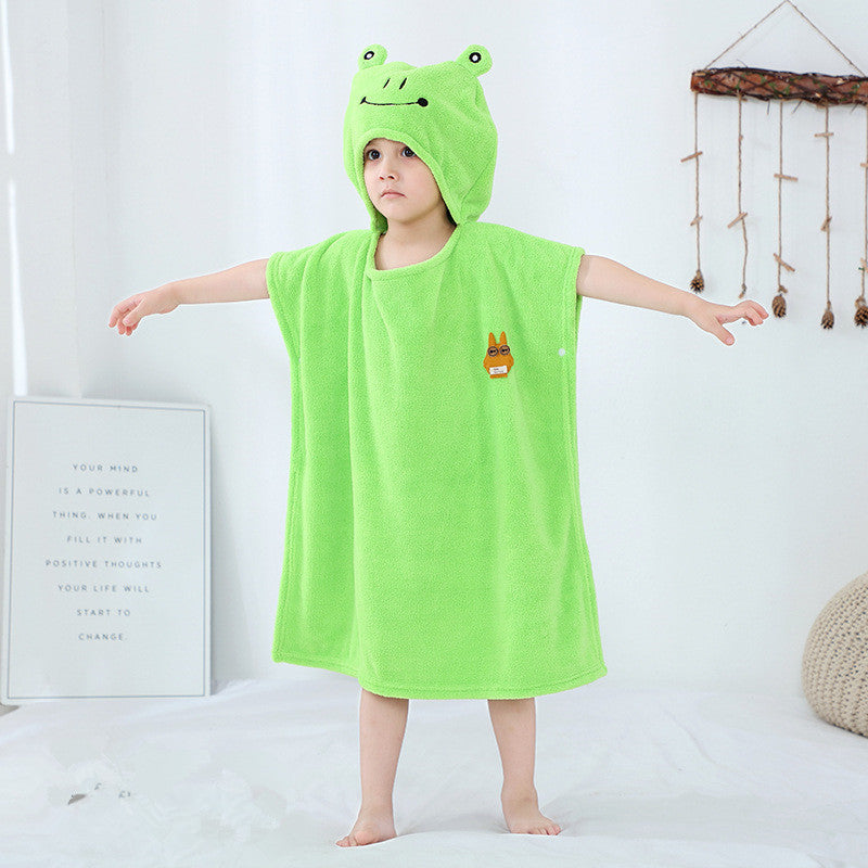 Child in bright green hooded towel with bird design. Infant bathrobe made of soft, antibacterial polyester for bath time.