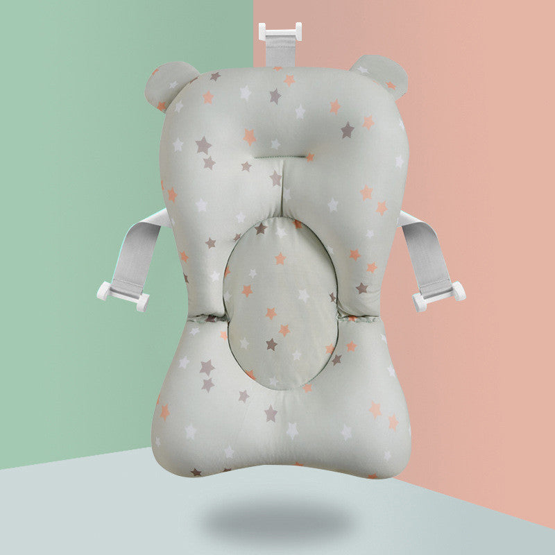 Star-patterned baby bath sponge with colorful bath beads and feather toy, ensuring safe and fun bath time.