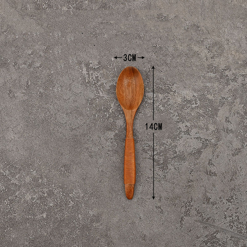 Set of solid wooden kitchen spoons for household cooking and serving – eco-friendly and durable utensils.
