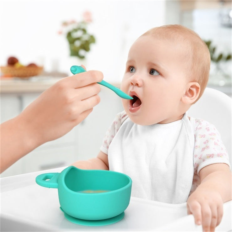 Silicone baby bowl and spoon set – food-grade, BPA-free suction bowl with soft-tip spoon for safe toddler feeding.
