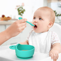 Silicone baby bowl and spoon set – food-grade, BPA-free suction bowl with soft-tip spoon for safe toddler feeding.
