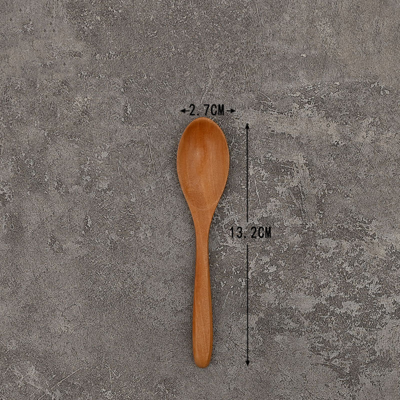 Set of solid wooden kitchen spoons for household cooking and serving – eco-friendly and durable utensils.
