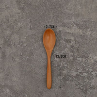 Set of solid wooden kitchen spoons for household cooking and serving – eco-friendly and durable utensils.
