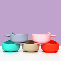 Silicone baby bowl and spoon set – food-grade, BPA-free suction bowl with soft-tip spoon for safe toddler feeding.
