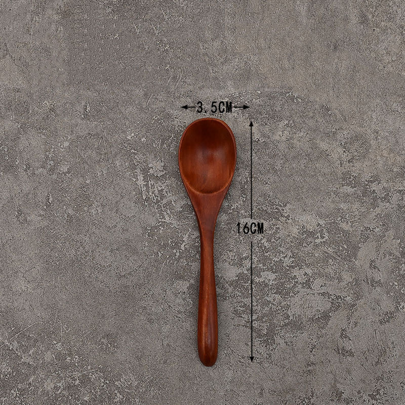 Set of solid wooden kitchen spoons for household cooking and serving – eco-friendly and durable utensils.
