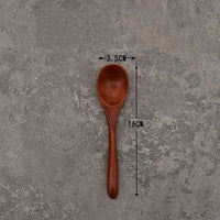 Set of solid wooden kitchen spoons for household cooking and serving – eco-friendly and durable utensils.
