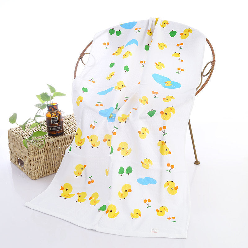 Cartoon Baby Bath Towel - Cotton Yarn | Lightweight, 60x120cm, with yellow ducklings, trees, and ponds on a white background.