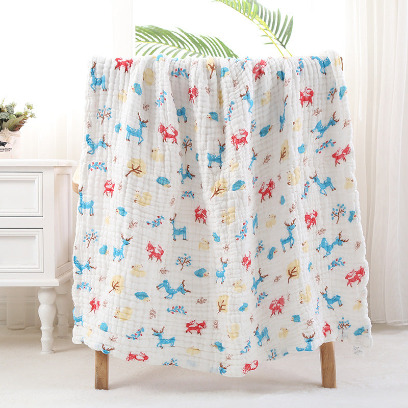 Folded cotton baby bath towel with yellow koala print, featuring soft six-layer seersucker quilt for newborn comfort.