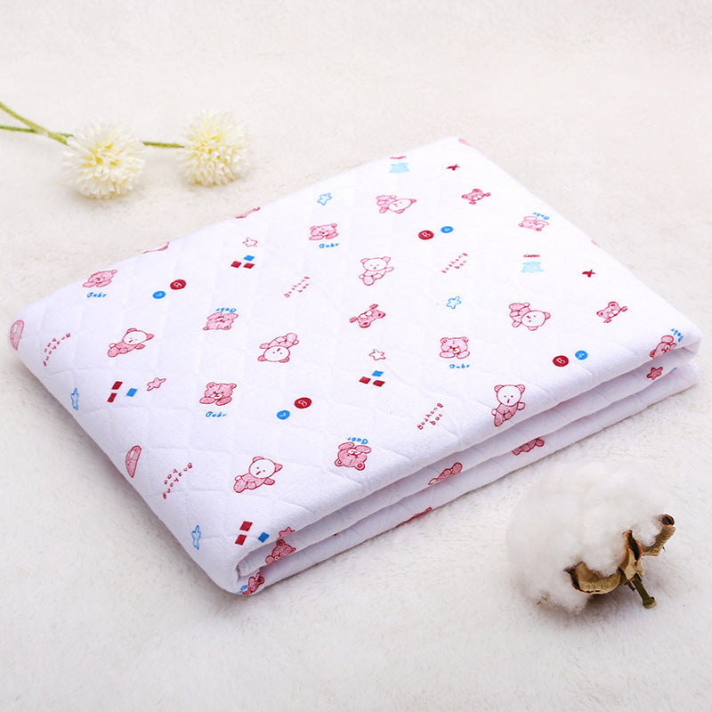 Folded white cotton baby blanket with red cartoon bear design. Soft and cozy quilt ideal for warmer seasons.