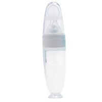 Silicone baby food spoon for rice cereal and puree; soft BPA-free spoon for safe infant feeding and gum protection.

