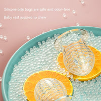 Happy Bite baby fruit feeder teether with soft silicone for introducing non-staple food and soothing teething discomfort.
