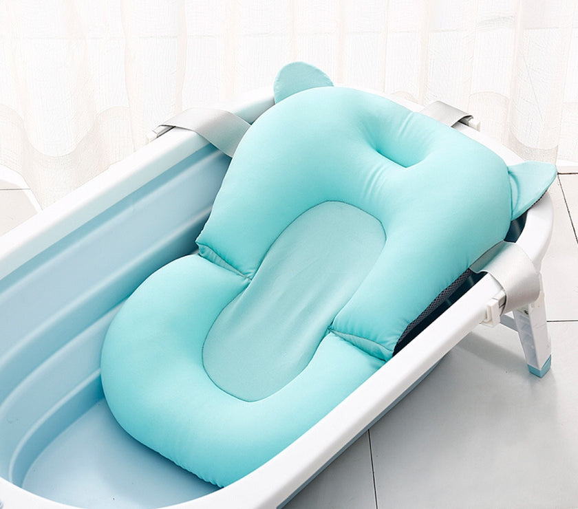 Soft adjustable baby bath net for newborns – suspended design for safety and comfort during bath time.
