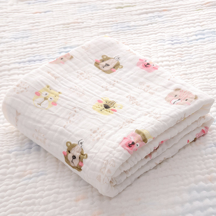 Folded yellow duck print cotton baby bath towel with soft seersucker quilt, ideal for newborns and quick moisture absorption.
