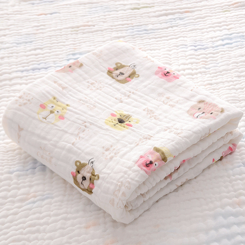 Folded yellow duck print cotton baby bath towel with soft seersucker quilt, ideal for newborns and quick moisture absorption.
