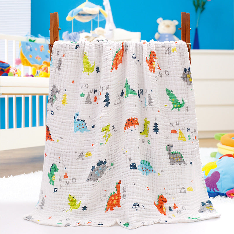 Folded cotton baby bath towel with orange and blue cloud print, featuring six-layer seersucker quilt for softness and absorbency.