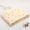 Folded yellow cotton baby blanket with cartoon print, made from breathable space cotton. Ideal for warm weather use.