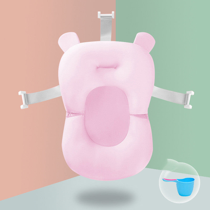 Green pig-shaped Non-slip Sponge Baby Bath with safety straps, designed for infant spine protection and comfort.