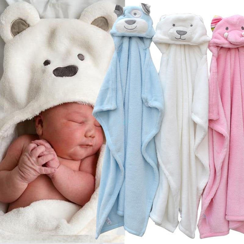 Soft baby bath towel folded next to bath essentials