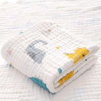 Folded cotton baby bath towel with orange and blue animal print, made with soft six-layer seersucker quilt for quick drying.