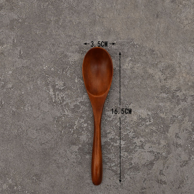 Set of solid wooden kitchen spoons for household cooking and serving – eco-friendly and durable utensils.
