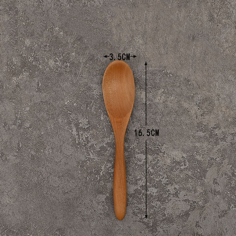 Set of solid wooden kitchen spoons for household cooking and serving – eco-friendly and durable utensils.
