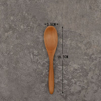 Set of solid wooden kitchen spoons for household cooking and serving – eco-friendly and durable utensils.
