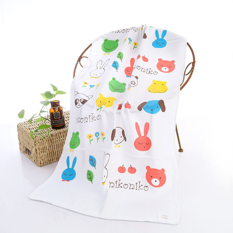 Cartoon Baby Bath Towel - Cotton Yarn | Lightweight, 60x120cm, showing cute animal faces and the word 'niconiko' in a grid layout.