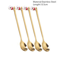 Festive Merry Christmas party spoons for holiday dinners and table decorations – red and green Xmas-themed cutlery.
