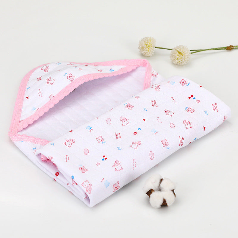 White cotton hooded baby blanket with pink cartoon print and soft trim. Summer-ready quilted blanket for infants.
