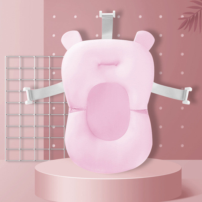 Pink Non-slip Baby Bath Sponge with colorful bath beads and feather toy for safe and fun baby bath time.