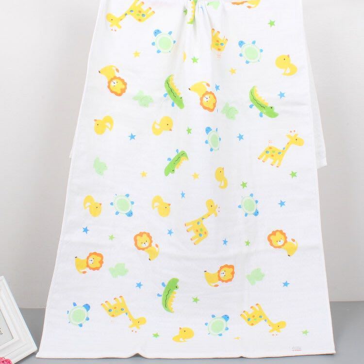 Cartoon Baby Bath Towel - Cotton Yarn | Lightweight, 60x120cm, featuring yellow lions, green dinosaurs, and giraffes in a playful pattern.