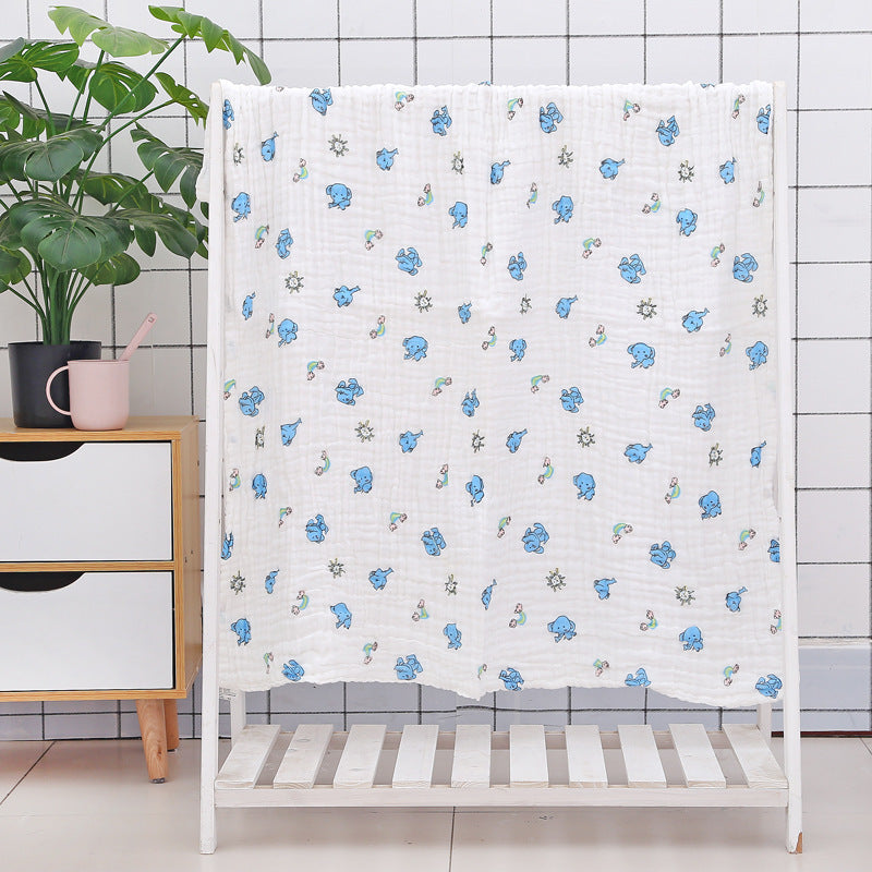 Folded cotton baby bath towel with cute animal face print, featuring six-layer seersucker quilt for softness and absorbency.