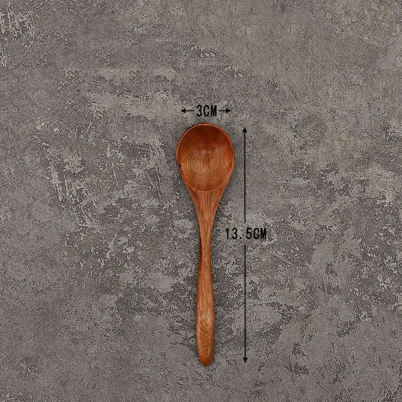 Set of solid wooden kitchen spoons for household cooking and serving – eco-friendly and durable utensils.
