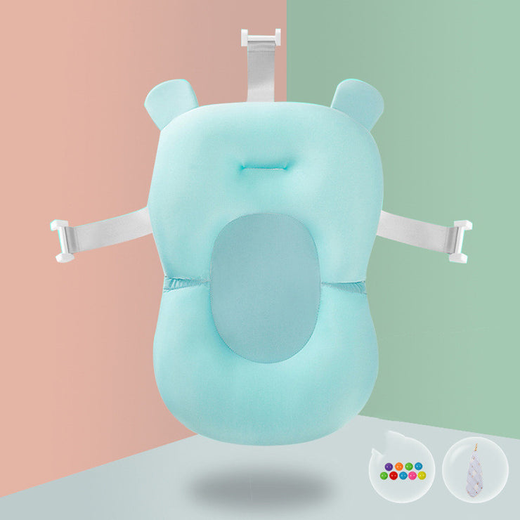Aqua baby bath sponge with pink lion teether accessory, designed for safe and comfortable infant bathing.