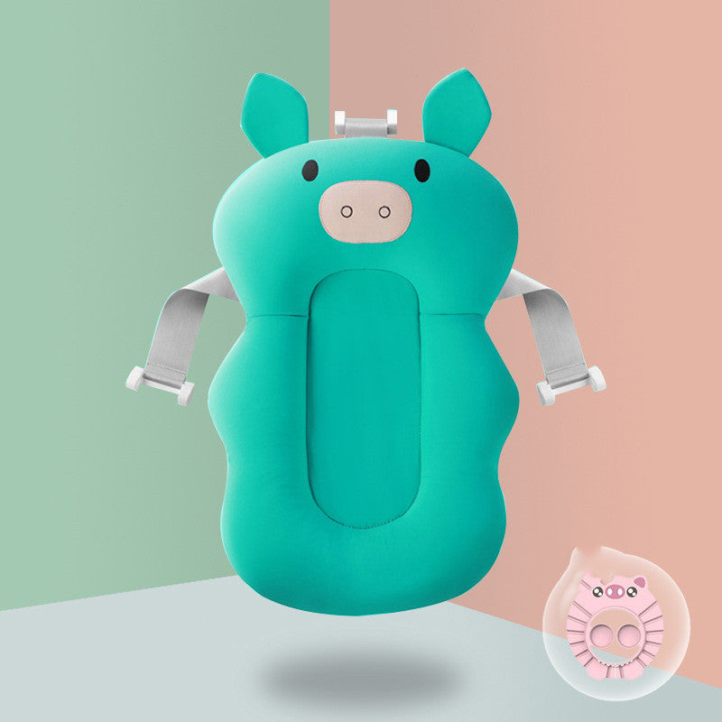 Green pig Non-slip Sponge Baby Bath with blue rinse cup, designed for safe and spine-supportive infant bathing.