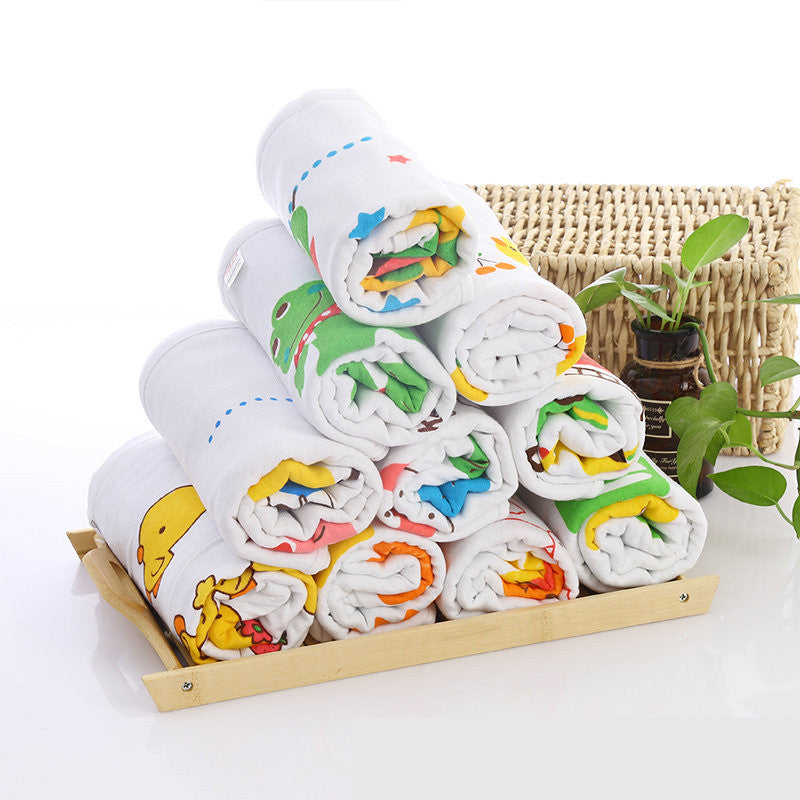 Cartoon Baby Bath Towel - Cotton Yarn | Lightweight, 60x120cm, featuring rolled towels with colorful animal prints stacked on a bamboo tray.