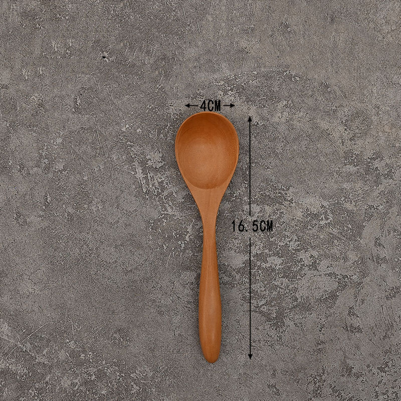 Set of solid wooden kitchen spoons for household cooking and serving – eco-friendly and durable utensils.

