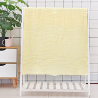 Light blue cotton baby bath towel with six-layer seersucker quilt, ultra-soft and absorbent for baby bath time.